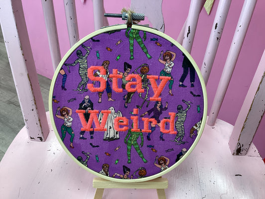 Stay weird (Orange lettering) by Toria Creates
