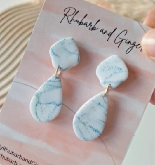 White elegant dangles with blue and green sparkle details Earrings by Rhubarb & Ginger