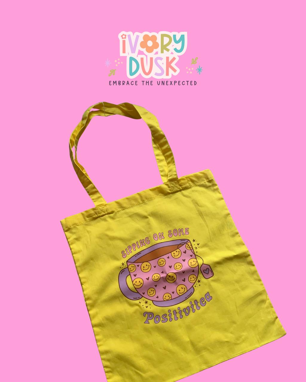 Sipping on some Positivitea Tote Bag by Ivory Dusk