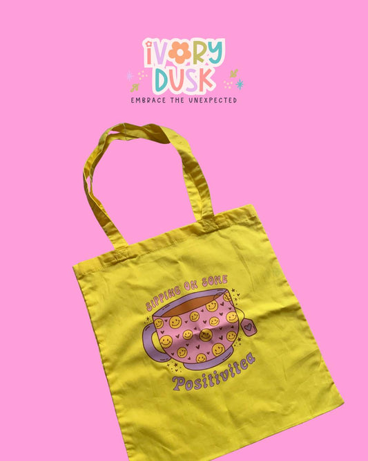 Sipping on some Positivitea Tote Bag by Ivory Dusk